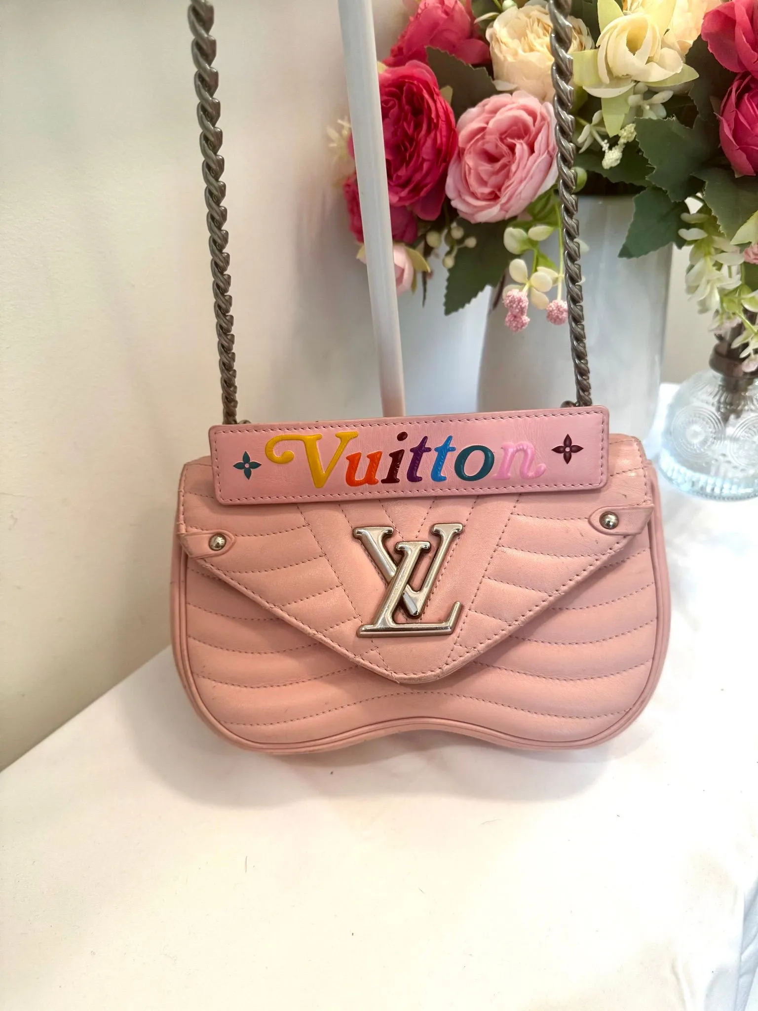 Authenticated Pink Louis Vuitton Wave Crossbody — pre-owned luxury designer bag | LaceLuxx