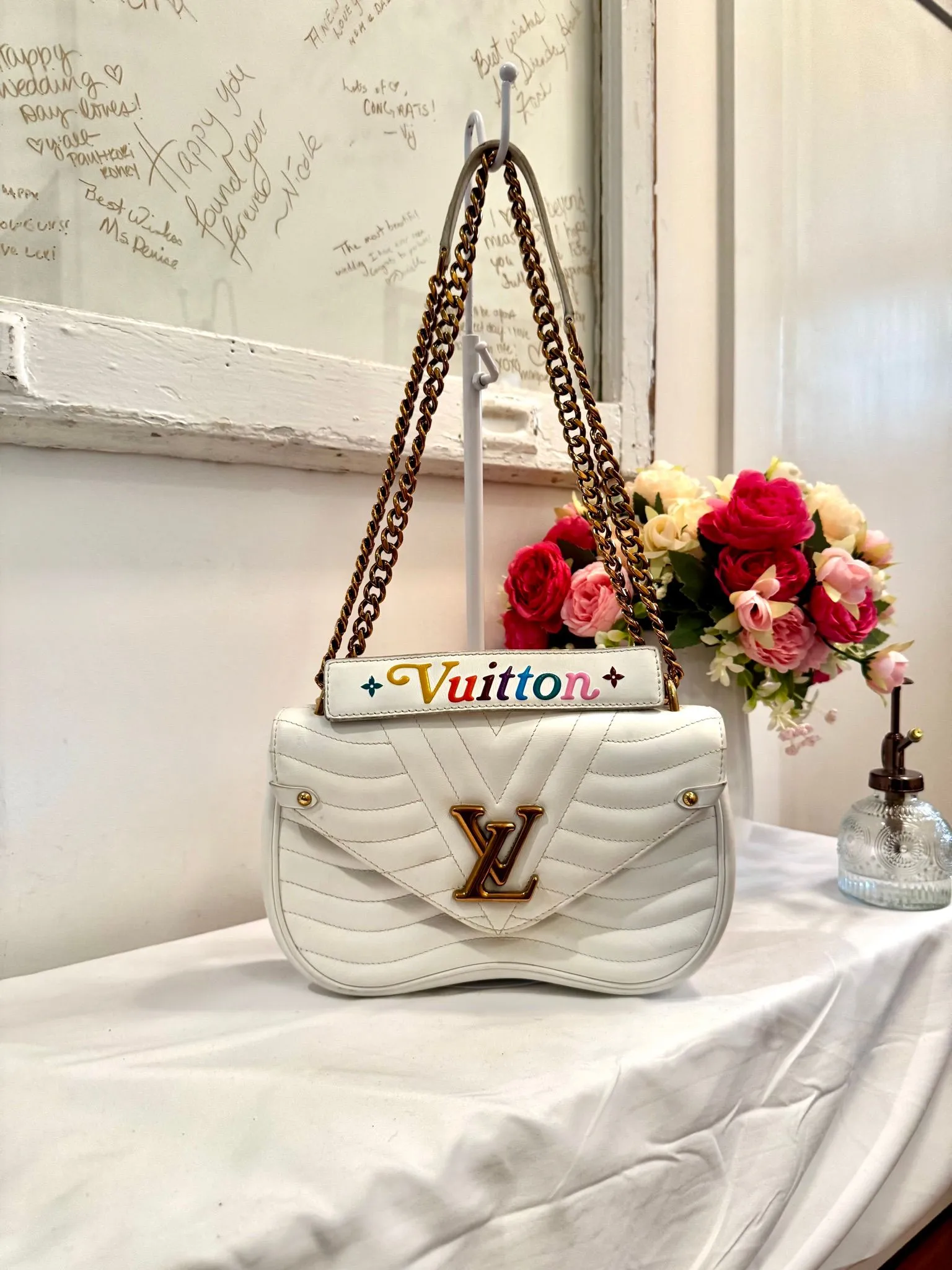 Authenticated White Louis Vuitton Wave Crossbody — pre-owned luxury designer bag | LaceLuxx