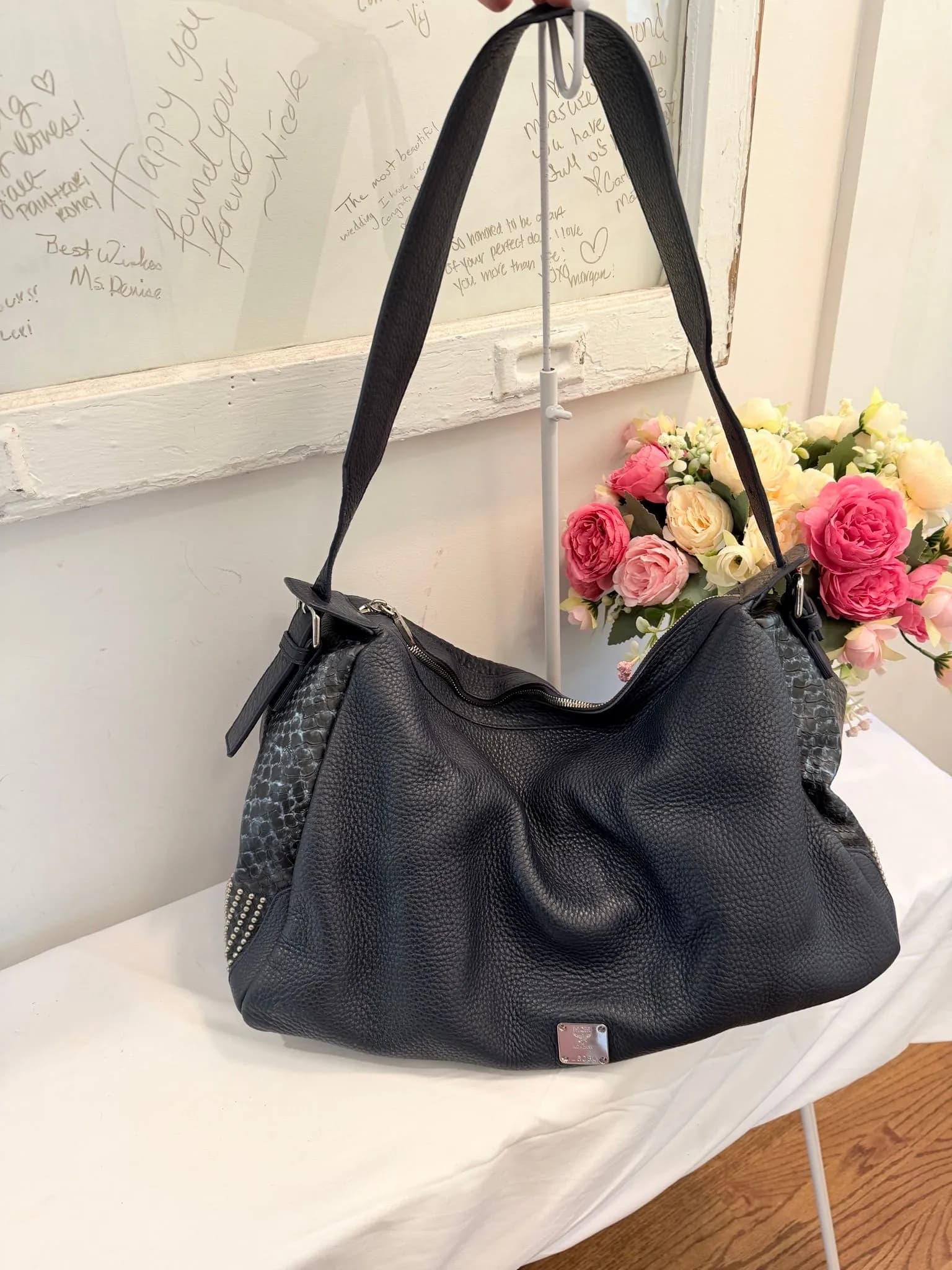 Authenticated MCM Large Navy and Silver Studded Hobo Bag — pre-owned luxury designer bag | LaceLuxx
