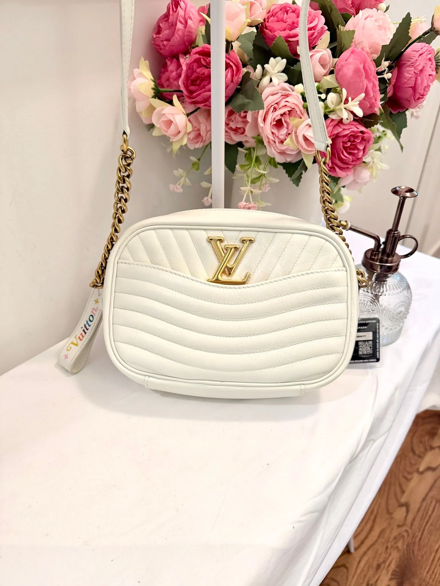 Authenticated White Louis Vuitton Wave Camera Bag Crossbody — pre-owned luxury designer bag | LaceLuxx
