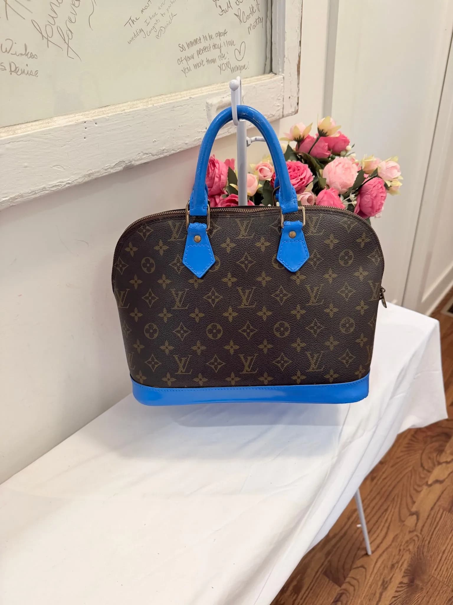 Authenticated Louis Vuitton Monogram Alma with Painted Blue Trim — pre-owned luxury designer bag | LaceLuxx